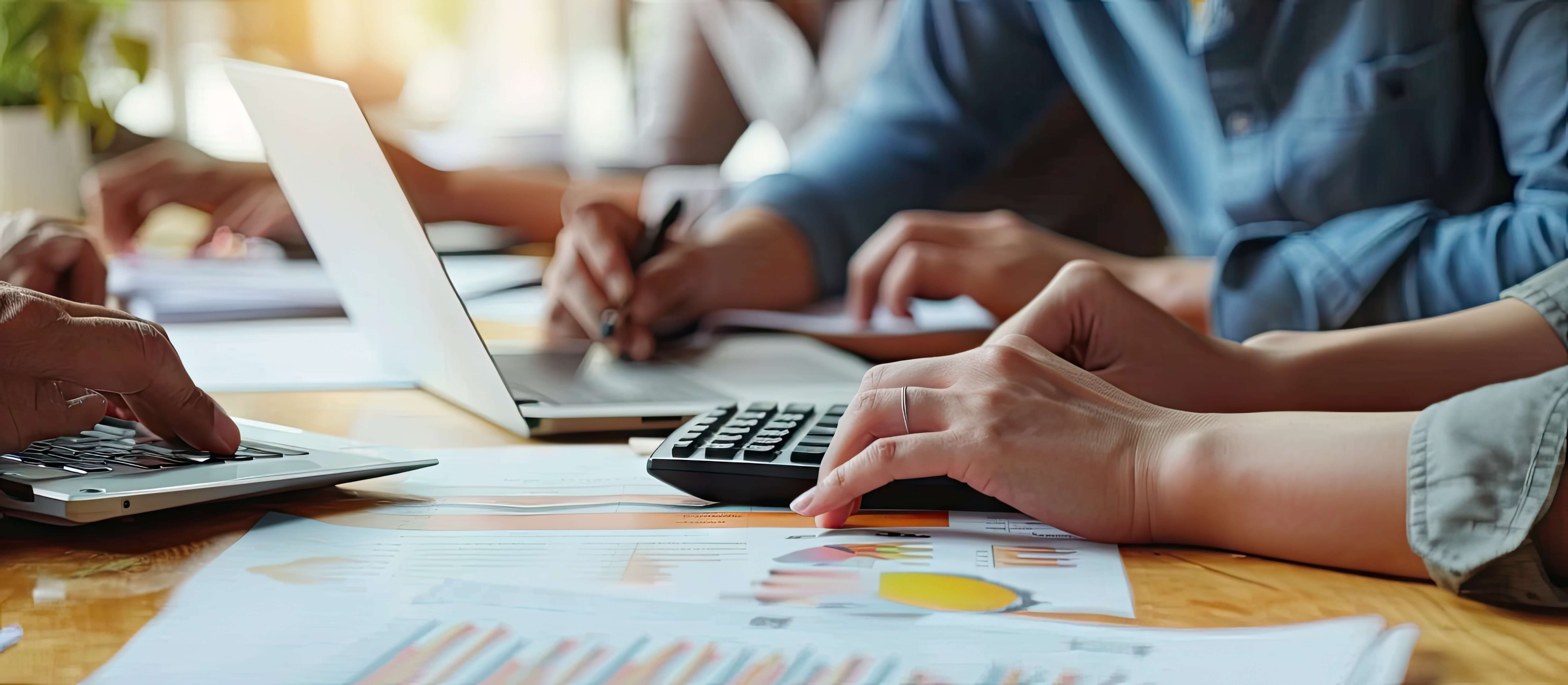Business team calculating values