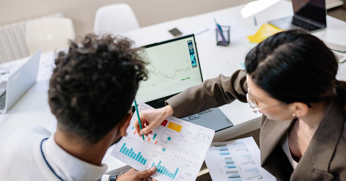 Team reviewing customer analytics and engagement data to optimize loyalty program strategy