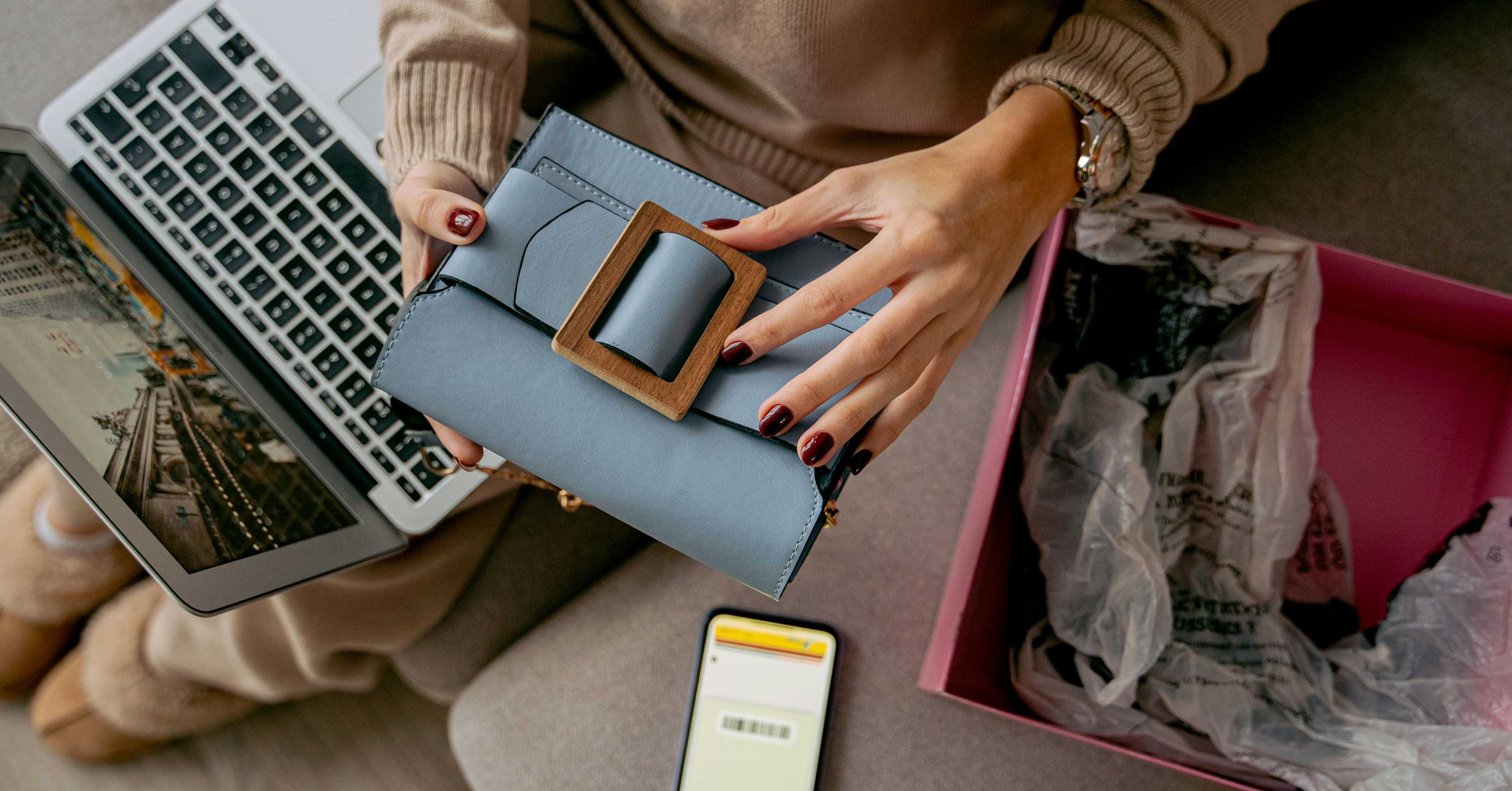 woman holding a new purchase from an online retail shop for a retail loyalty program example